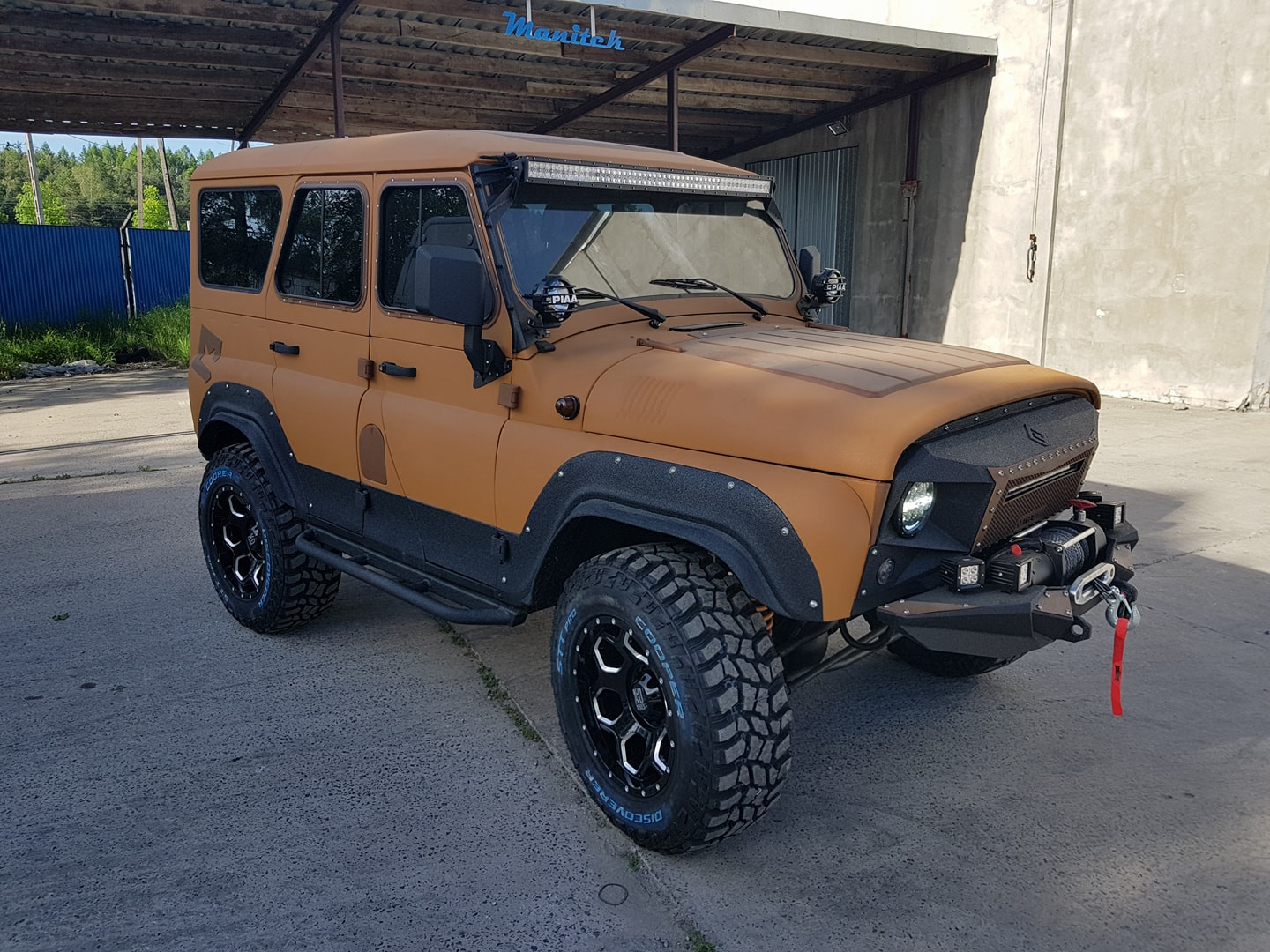 Land Rover 4x4 fully coated with Warrior textured paint, parked outdoors