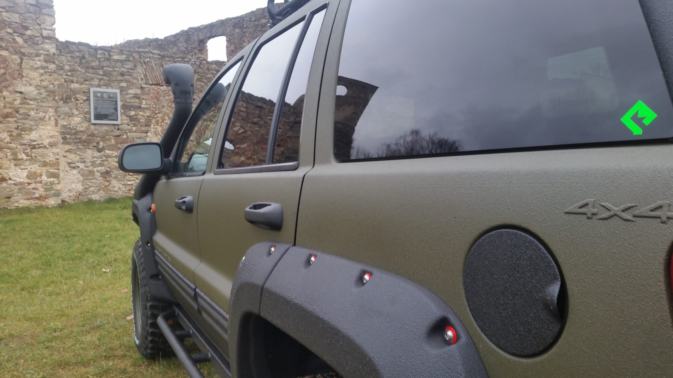 Side view of a 4x4 vehicle with Warrior textured polyurethane coating
