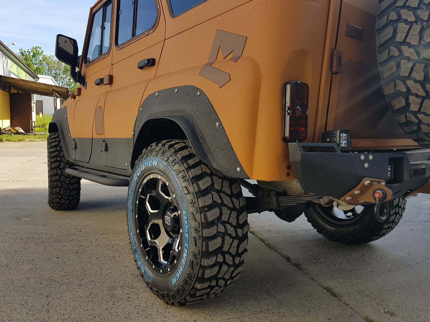 Rear view of a 4x4 vehicle coated with Warrior structured paint