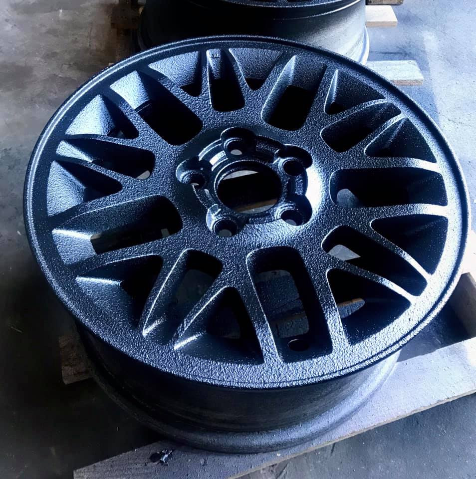 Close-up of a wheel rim coated with Warrior textured paint